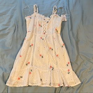 White floral dress a little stain in front, will go away with wash